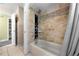 Modern bathroom featuring a tiled shower/tub combo with a unique shower panel at 2430 Mill Run Blvd, Kissimmee, FL 34744