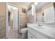 Bright bathroom featuring tile flooring, a white vanity, and a shower/tub combination at 2430 Mill Run Blvd, Kissimmee, FL 34744