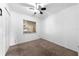 Cozy bedroom with a window providing natural light and soft carpet flooring at 2430 Mill Run Blvd, Kissimmee, FL 34744