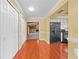 Hallway provides access to the kitchen and a Gathering room with a stone fireplace at 2430 Mill Run Blvd, Kissimmee, FL 34744
