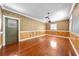 Cozy living room showcasing wood-look floors and chair rail at 2430 Mill Run Blvd, Kissimmee, FL 34744