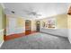 Bright living room with a large window, wood floors, and neutral carpeting at 2430 Mill Run Blvd, Kissimmee, FL 34744
