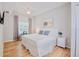 Bright bedroom with laminate floors, a ceiling fan, and a workspace by the window at 2611 Gala N Rd # 101, Kissimmee, FL 34746