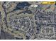 Community aerial view featuring golf course, lake, and nearby amenities at 2615 Autumn Green Dr, Orlando, FL 32822