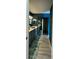 Modern bathroom with dual vanity, sleek countertops, dark walls and a large sliding-door mirrored closet at 2615 Autumn Green Dr, Orlando, FL 32822