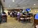 Bright community dining area with ample seating and a full bar at 2615 Autumn Green Dr, Orlando, FL 32822