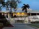 Charming exterior view of the 19th Hole restaurant, featuring landscaping, and inviting entrance at 2615 Autumn Green Dr, Orlando, FL 32822