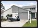 Charming single-Gathering home featuring a well-maintained lawn and a convenient attached garage at 2615 Autumn Green Dr, Orlando, FL 32822