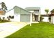 Charming two-story home with a well-maintained lawn and driveway at 2615 Autumn Green Dr, Orlando, FL 32822