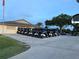 Neatly parked golf carts outside a community building, offering convenience for residents and players at 2615 Autumn Green Dr, Orlando, FL 32822