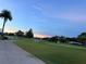 Scenic view of the well-maintained golf course and putting green at 2615 Autumn Green Dr, Orlando, FL 32822
