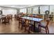Spacious community library with large tables and ample reading material at 2615 Autumn Green Dr, Orlando, FL 32822