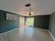 Spacious living room with hardwood floors and a view of the lake at 2615 Autumn Green Dr, Orlando, FL 32822