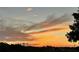 Beautiful sunset sky with bright orange and yellow colors at 2615 Autumn Green Dr, Orlando, FL 32822
