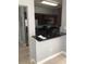 Kitchen with dark cabinets, granite countertops, stainless steel appliances, and tile flooring at 3567 Conroy Rd # 1213, Orlando, FL 32839