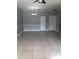 Spacious living room with tile flooring, neutral paint, and ample space for furniture arrangement at 3567 Conroy Rd # 1213, Orlando, FL 32839
