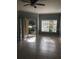 Bright and airy living room with tile flooring, a ceiling fan, and sliding glass doors at 3567 Conroy Rd # 1213, Orlando, FL 32839