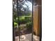 View from screened patio of community lake with fountains and lush landscaping at 3567 Conroy Rd # 1213, Orlando, FL 32839