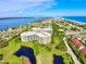 Sweeping aerial view of waterfront condo community near beaches and waterways at 4 Oceans West Blvd # 301B, Daytona Beach Shores, FL 32118