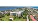 High-angle view of a condo complex adjacent to a golf course with water views and beach access at 4 Oceans West Blvd # 301B, Daytona Beach Shores, FL 32118