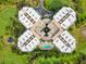 Bird's-eye view of condo building featuring unique architecture, pool, and landscaping at 4 Oceans West Blvd # 301B, Daytona Beach Shores, FL 32118