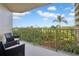 Spacious balcony with seating and scenic views of lush greenery at 4 Oceans West Blvd # 301B, Daytona Beach Shores, FL 32118