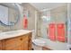 A bathroom with a pedestal sink, toilet, and a glass enclosed shower at 4 Oceans West Blvd # 301B, Daytona Beach Shores, FL 32118