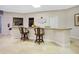 Serving bar area with chairs in the community common room at 4 Oceans West Blvd # 301B, Daytona Beach Shores, FL 32118