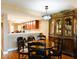 Inviting dining area featuring a round table, chairs, and decorative lighting fixture at 4 Oceans West Blvd # 301B, Daytona Beach Shores, FL 32118