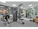 The community exercise room features machines, free weights, and a mirrored wall at 4 Oceans West Blvd # 301B, Daytona Beach Shores, FL 32118