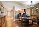 Open-concept design connecting to hallway with wood floors and modern decor at 4 Oceans West Blvd # 301B, Daytona Beach Shores, FL 32118