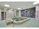 An indoor hot tub with tile walls and windows at 4 Oceans West Blvd # 301B, Daytona Beach Shores, FL 32118