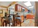 This kitchen features wood cabinets, updated appliances, granite counters and space for a breakfast table at 4 Oceans West Blvd # 301B, Daytona Beach Shores, FL 32118