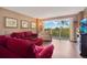 Bright living room with plush seating, wood floors, and outdoor views at 4 Oceans West Blvd # 301B, Daytona Beach Shores, FL 32118