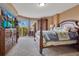 Spacious main bedroom featuring balcony access, wood furniture, and a view at 4 Oceans West Blvd # 301B, Daytona Beach Shores, FL 32118