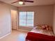 Cozy bedroom with natural light, complemented by plush pillows and a ceiling fan at 4328 S Kirkman Rd # 1, Orlando, FL 32811