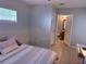 Bedroom adjacent to a full bathroom, featuring natural light and tile flooring at 4328 S Kirkman Rd # 1, Orlando, FL 32811
