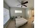 Comfortable bedroom with bright natural light, a ceiling fan, and easy access to a full bath at 4328 S Kirkman Rd # 1, Orlando, FL 32811