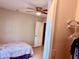 Simple bedroom featuring a ceiling fan and tiled flooring with a modest closet at 4328 S Kirkman Rd # 1, Orlando, FL 32811