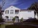 Charming two-story condo with gray doors and a cozy balcony on a sunny day at 4328 S Kirkman Rd # 1, Orlando, FL 32811