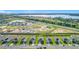 New construction community with stunning aerial views of homes, landscaping, and surrounding lakes at 452 Burnham Cir, Auburndale, FL 33823