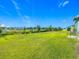 Expansive backyard featuring lush green grass and providing ample space for outdoor activities at 452 Burnham Cir, Auburndale, FL 33823
