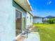 A patio featuring a bench and view of the lawn at 452 Burnham Cir, Auburndale, FL 33823
