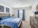 Inviting bedroom features a large bed and natural light at 452 Burnham Cir, Auburndale, FL 33823