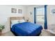 Cozy bedroom featuring a comfortable bed, soothing decor, and natural light from the window at 452 Burnham Cir, Auburndale, FL 33823