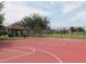 Community basketball court with a shelter, picnic benches and a scenic view of the neighborhood at 5365 Dahlia Reserve Dr, Kissimmee, FL 34758