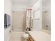 Neutral bathroom showcasing a tub and shower combo, vanity, and a privacy window at 5365 Dahlia Reserve Dr, Kissimmee, FL 34758