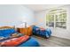 Bedroom with two twin beds and a dresser at 5365 Dahlia Reserve Dr, Kissimmee, FL 34758