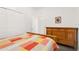 Bedroom featuring a wood bed frame, matching dresser, and white walls at 5365 Dahlia Reserve Dr, Kissimmee, FL 34758