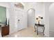 Welcoming foyer with neutral tile flooring, a stylish console table, and ample natural light at 5365 Dahlia Reserve Dr, Kissimmee, FL 34758